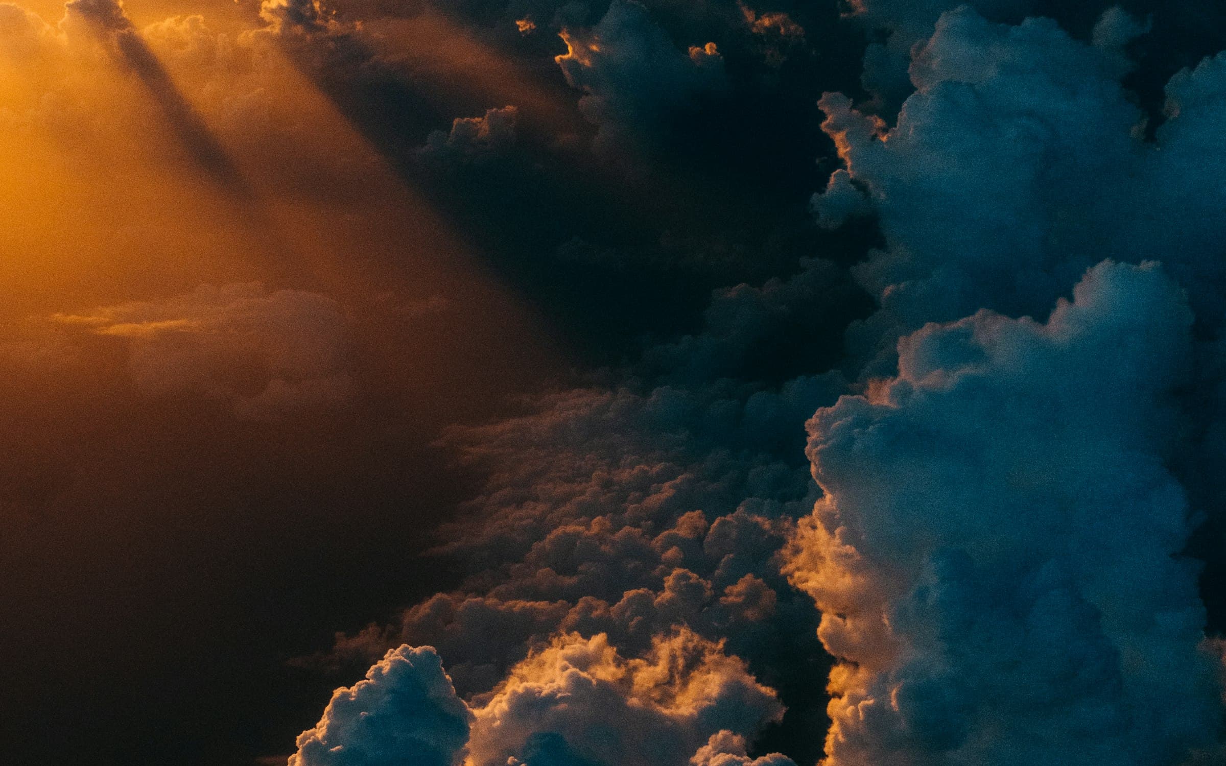 Dark clouds lit by warm light